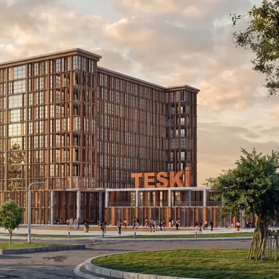 TESKİ Hizmet Binası projesi TESKİ tabelalı ana giriş cephesi, gün batımı görünümü - EÖÇ Mimarlık
